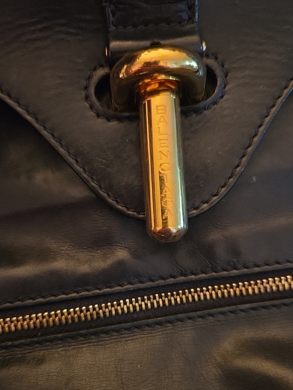 Balenciaga Black Leather  Bag with Gold Hardware Accent.